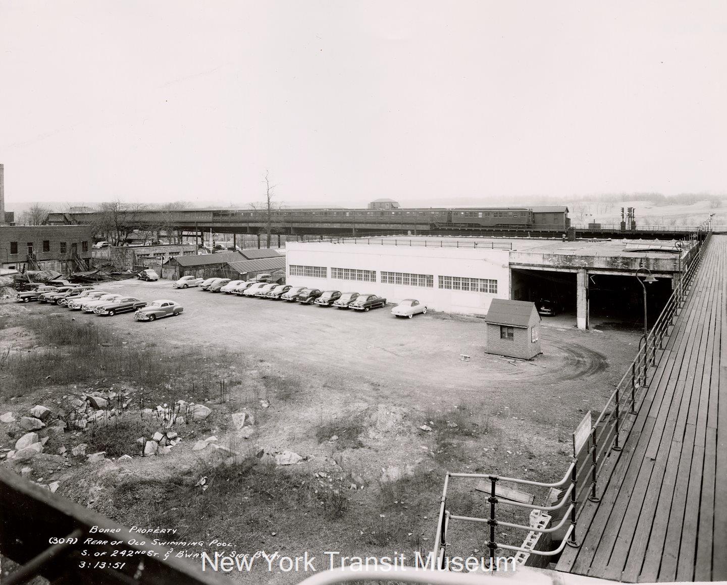 Also from the Transit Museum collection, an auto dealership storage lot has replaced the swimming pool.